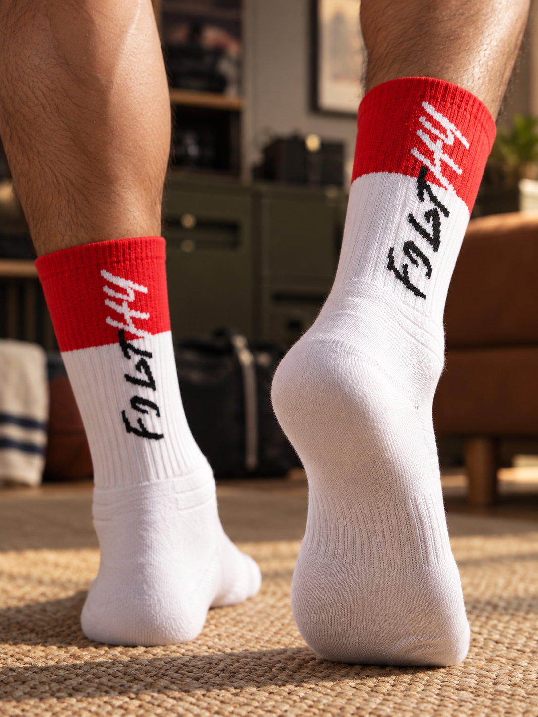 White and red patchwork football socks — low-angle rear lifestyle view